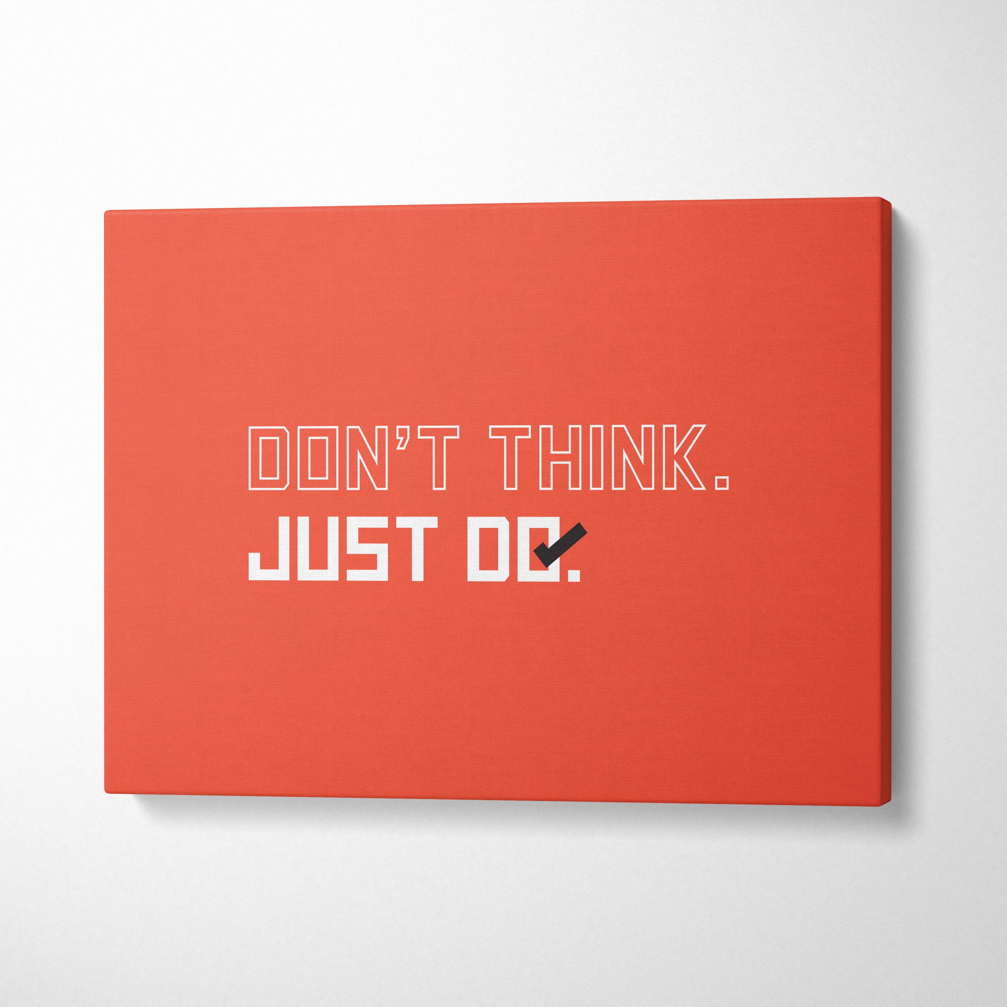 Vibrant orange canvas wall art with motivational dont think just do typography perfect for minimalist office decor