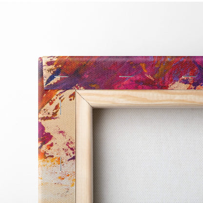 A vibrant tree abstract canvas print with magenta orange and purple splashes in a light wood frame wall art