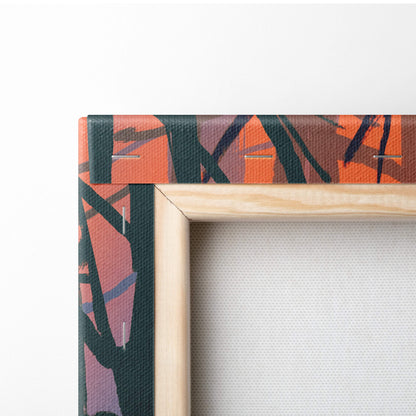 A vibrant abstract canvas art with bold orange black and purple brushstrokes framed in light wood for wall decor
