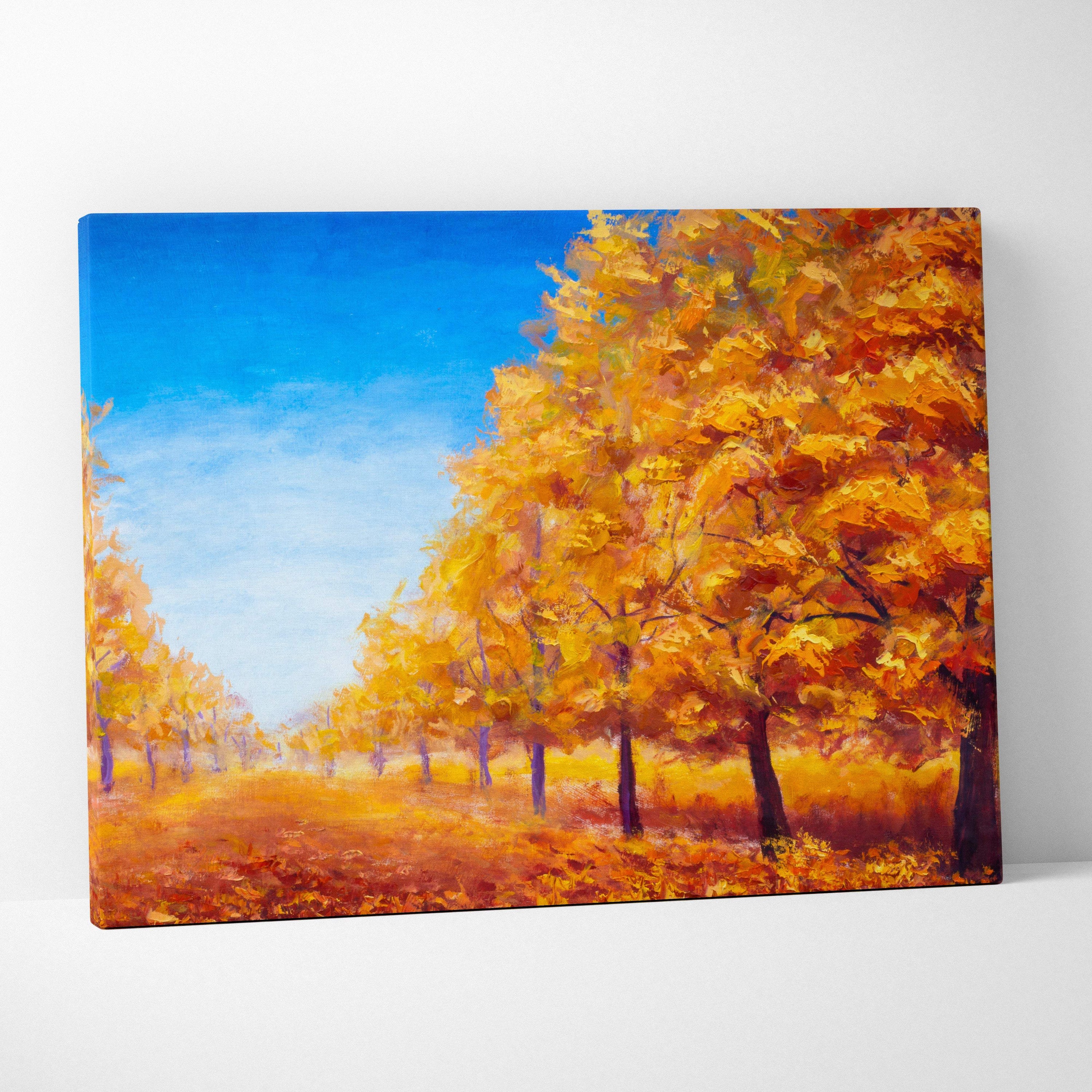 Vibrant autumn trees landscape painting on stretched canvas featuring golden and orange foliage with a blue sky