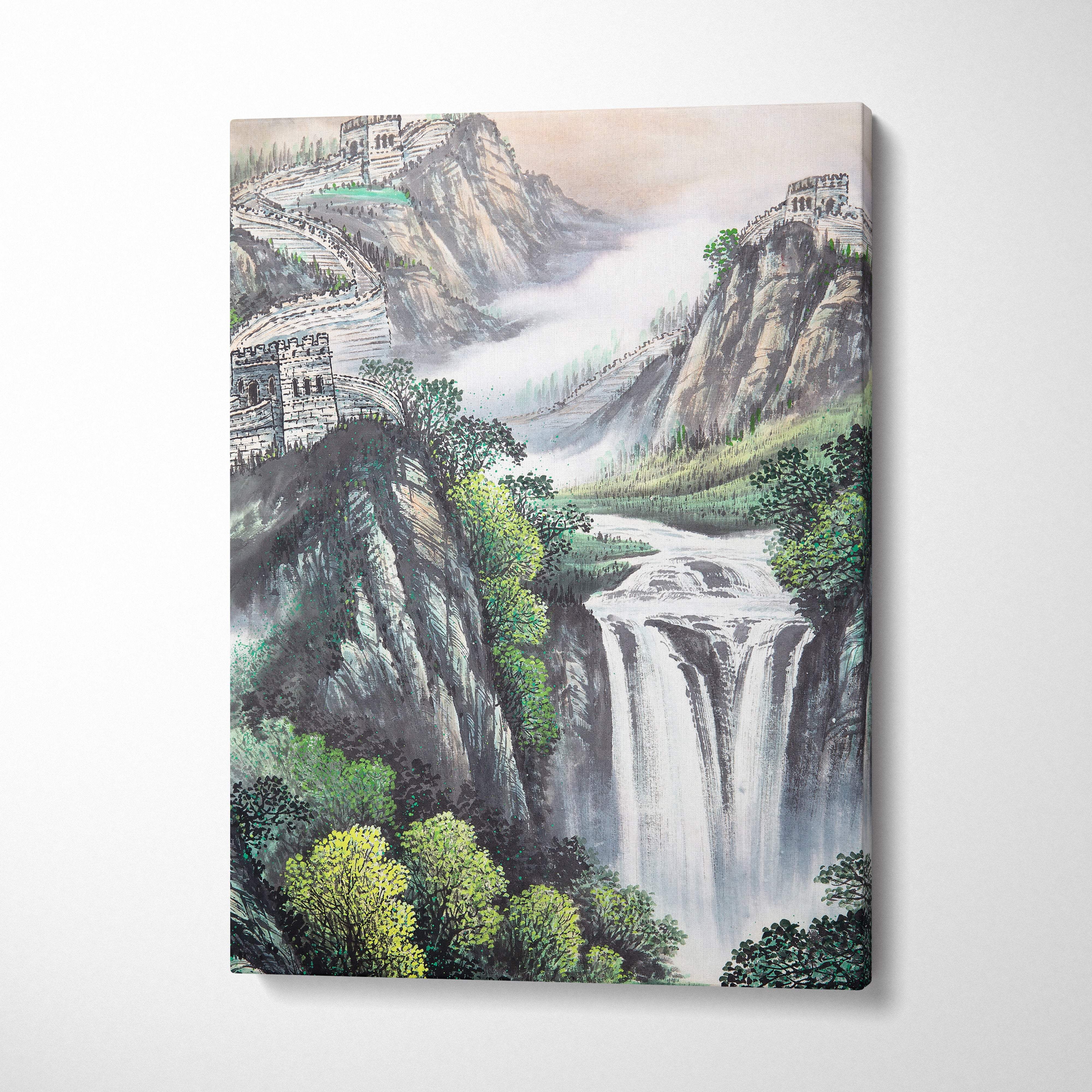 A framed canvas painting of a green orange sunrise waterfall and ancient stone fortifications in a serene mountain landscape