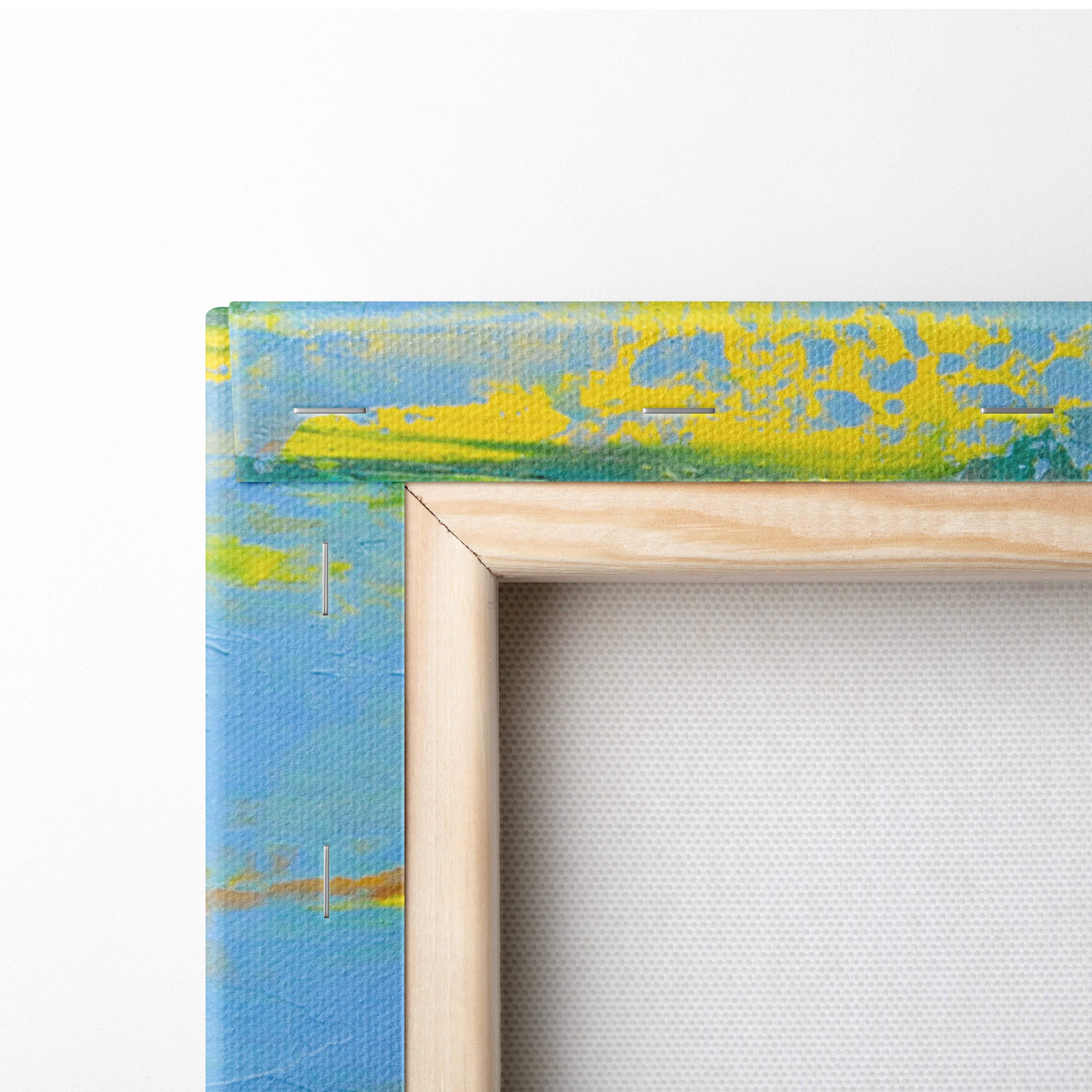 A wooden-framed canvas print featuring a textured modern abstract city skyline in blue and yellow hues