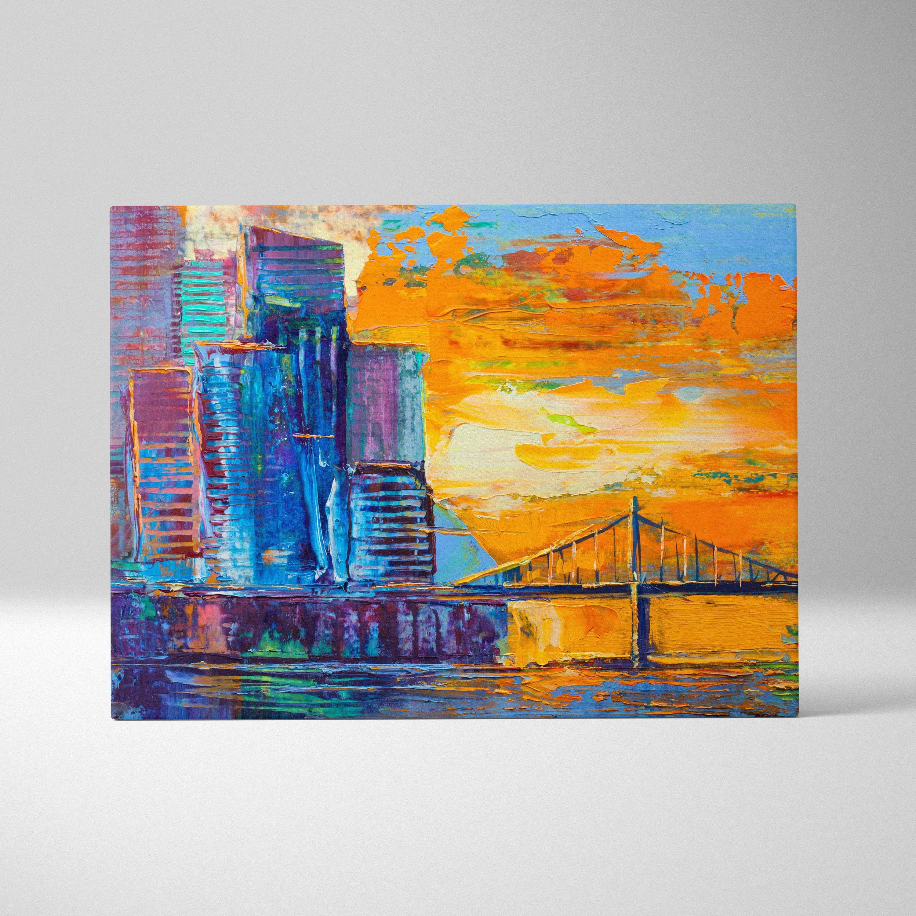 Modern abstract city skyline canvas print with bold blue and purple skyscrapers and fiery orange sunset background