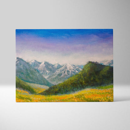 Rectangular canvas painting of alpine peaks with snow, green slopes, and golden wildflowers under a blue-purple sky