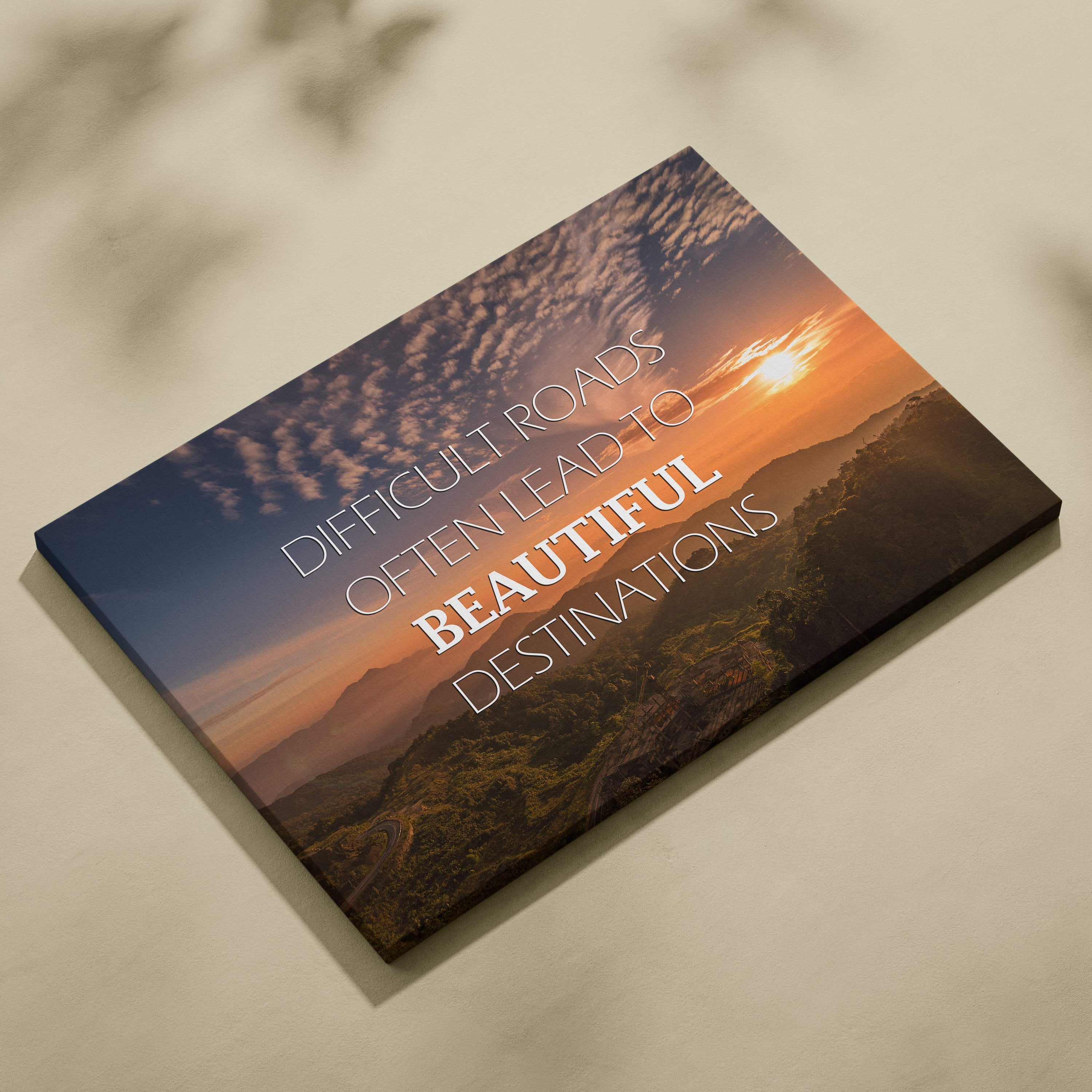 Motivational mountain sunset canvas wall art featuring a scenic orange sunset over mountains with an inspirational quote in white lettering