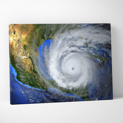 A rectangular canvas print of a massive hurricane swirling over a deep blue ocean with white spiral storm clouds and green landmasses
