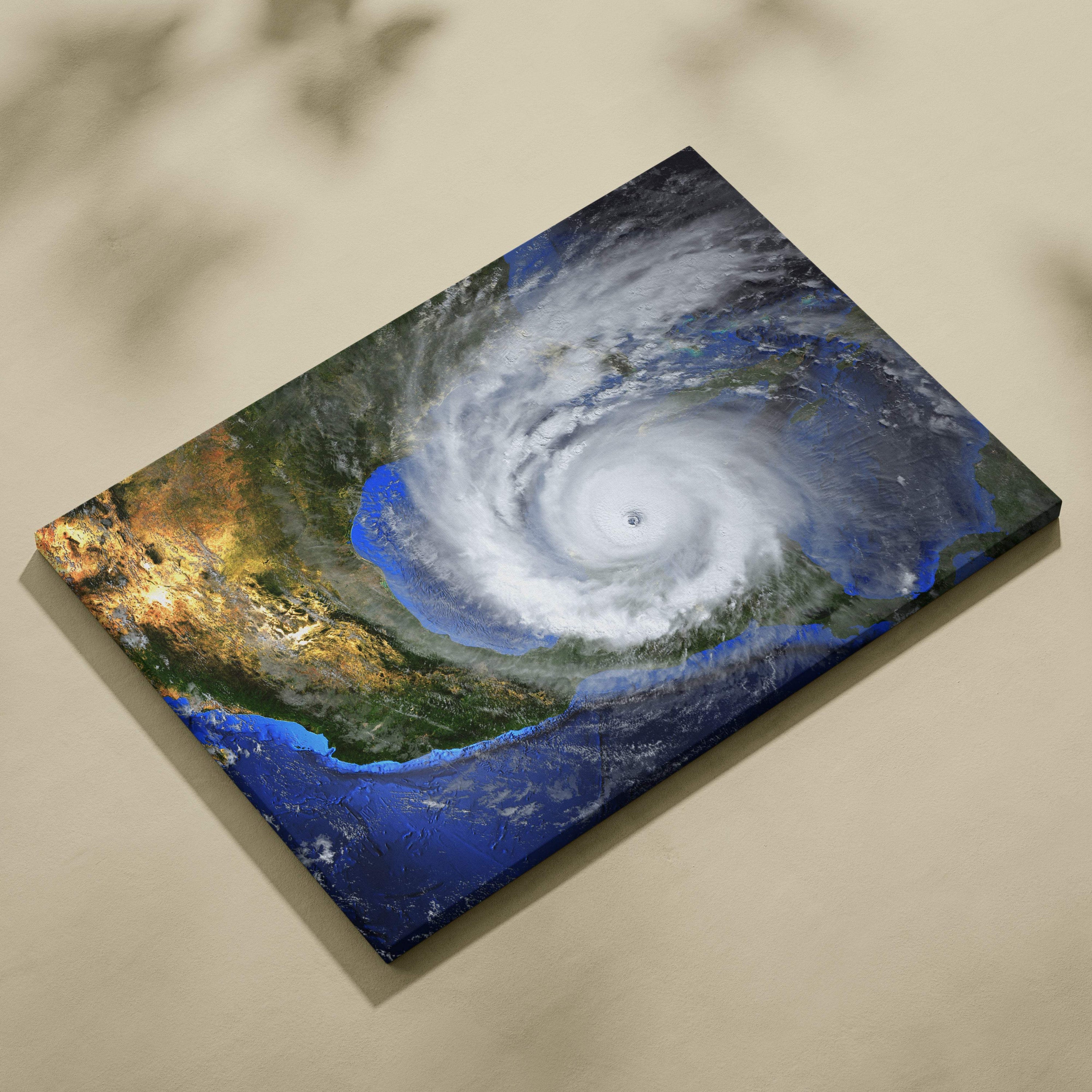 Rectangular canvas print of a massive hurricane with white clouds swirling over deep blue ocean and green landmasses
