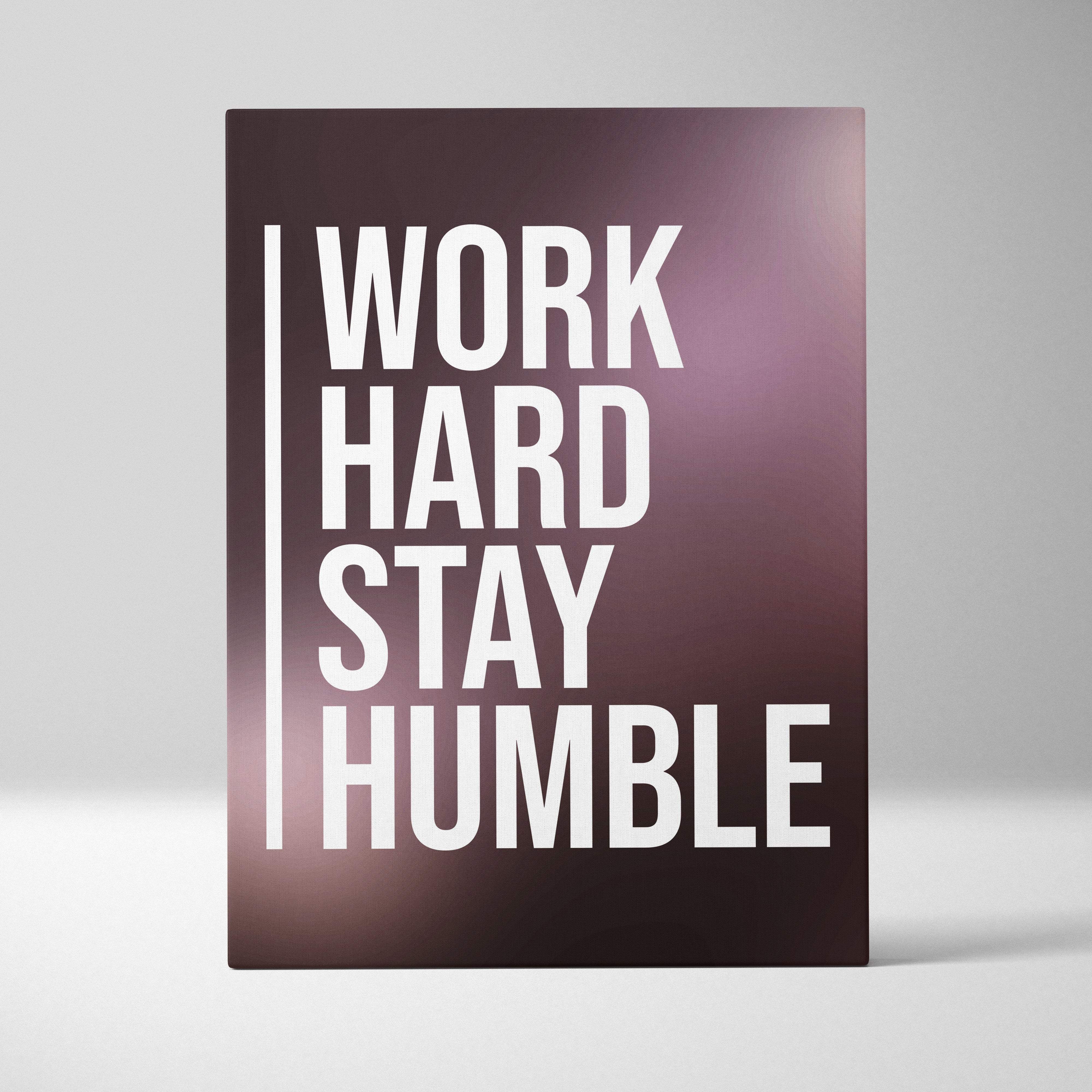 Work hard stay humble motivational canvas print with bold white text on a dark purple rectangular wall art