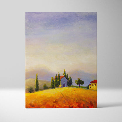 A rectangular canvas print of tuscan countryside landscape with golden fields cypress trees rustic houses and pastel sky