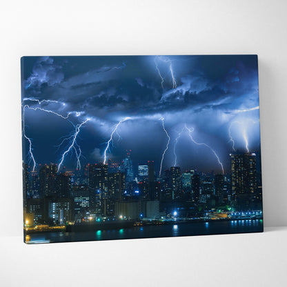 Canvas print of a city skyline at night with electric blue lightning strikes in a dramatic thunderstorm scene