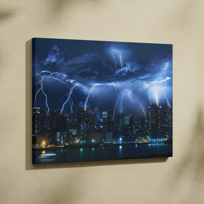 Canvas print of a dramatic nighttime cityscape with electric blue lightning strikes over illuminated skyscrapers and water