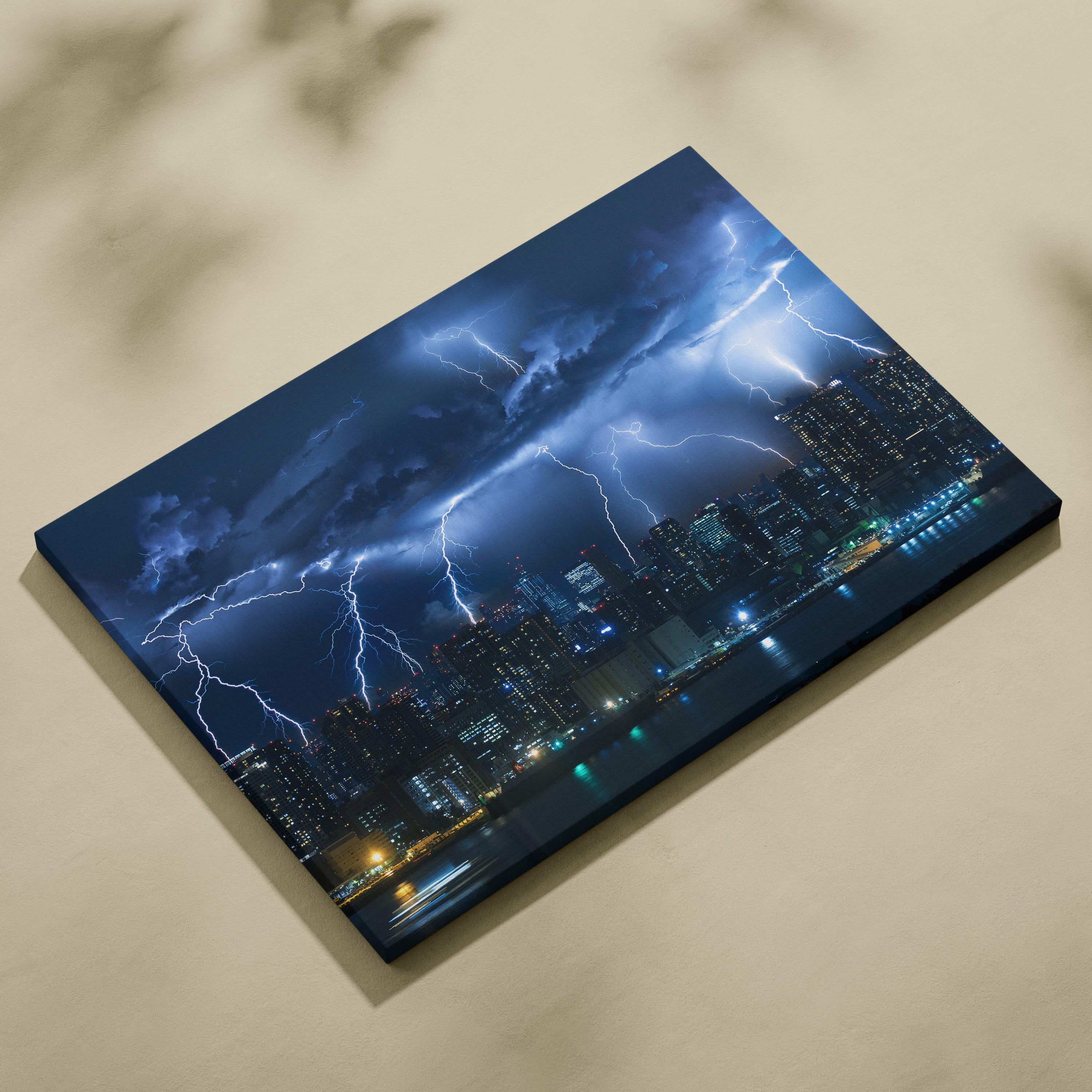 Canvas print of a dramatic nighttime cityscape with vivid electric blue lightning bolts illuminating the stormy sky