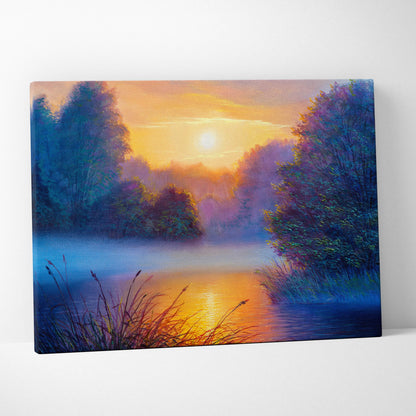A vibrant canvas print of a misty river sunset with warm orange hues and deep blue trees for serene wall art