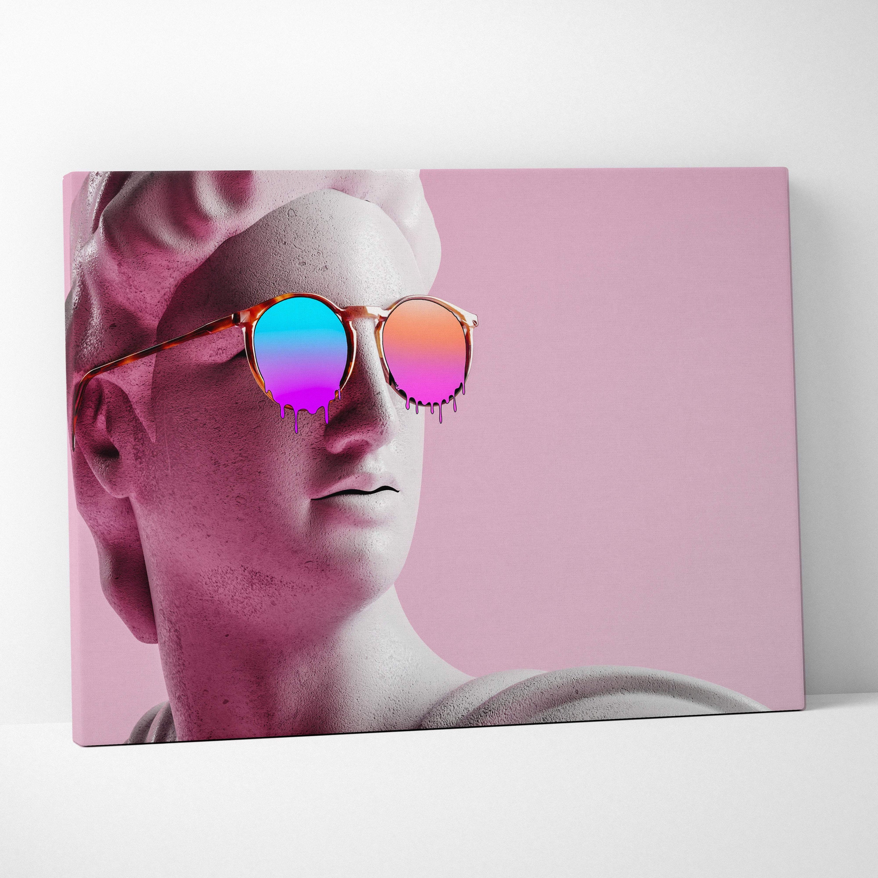 A canvas print of a classical marble statue head wearing round sunglasses with iridescent pink and blue lenses