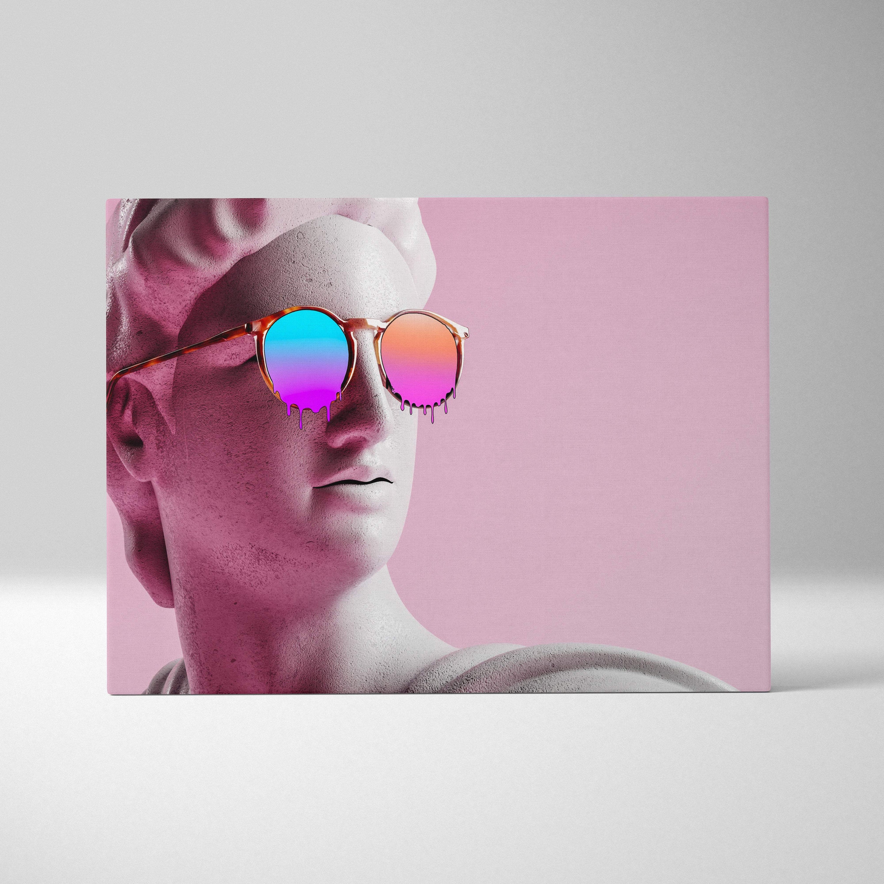 Contemporary canvas wall art of a white marble statue head wearing round sunglasses with iridescent pink and blue lenses