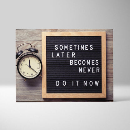 Motivational office canvas wall art with a black letterboard and white letters in a light wood frame with inspirational quote