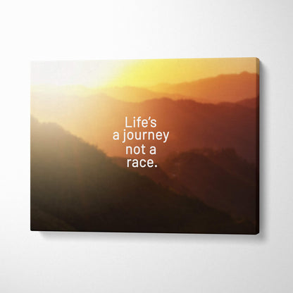 Motivational mountain sunset canvas wall art with warm orange tones and life’s a journey not a race quote print