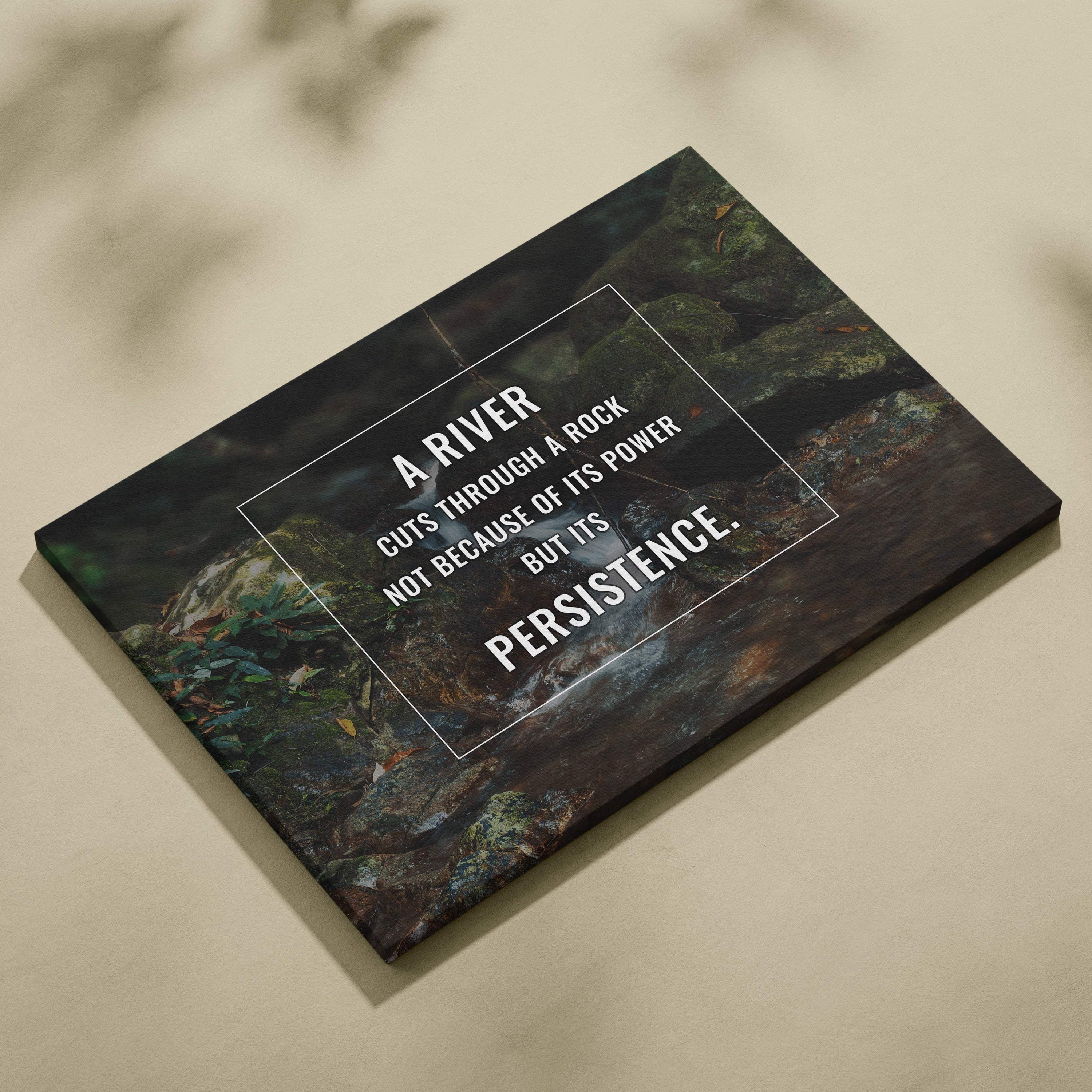 Motivational river canvas wall art with a dark green textured rock and water image featuring a persistence quote print