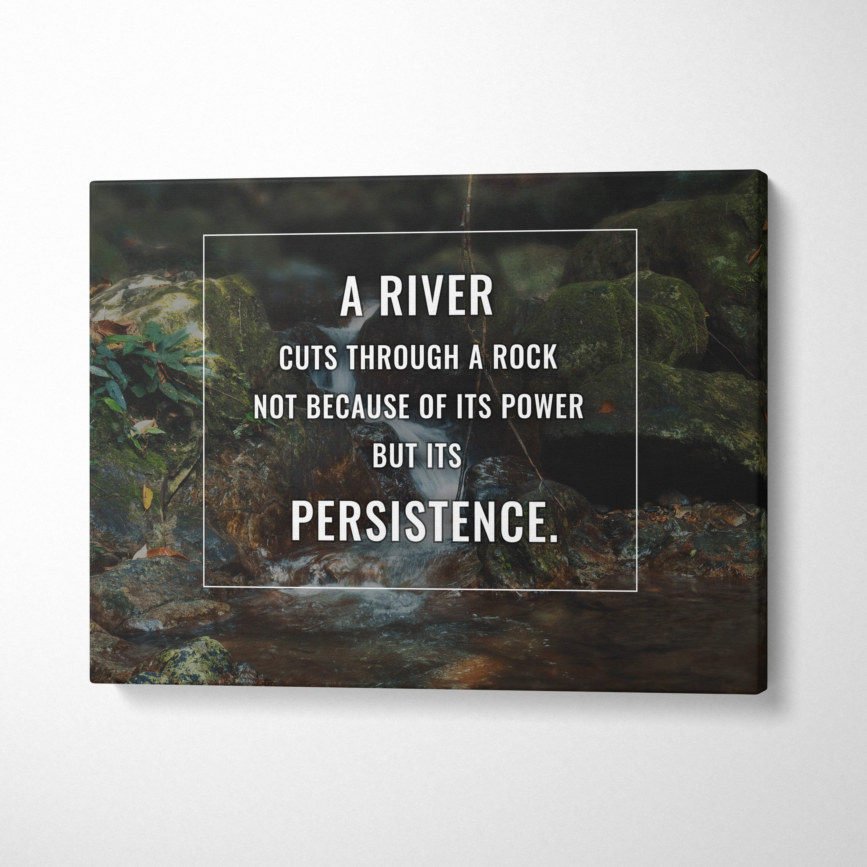 Motivational river canvas wall art featuring a dark green nature stream with mossy rocks and persistence inspirational quote print