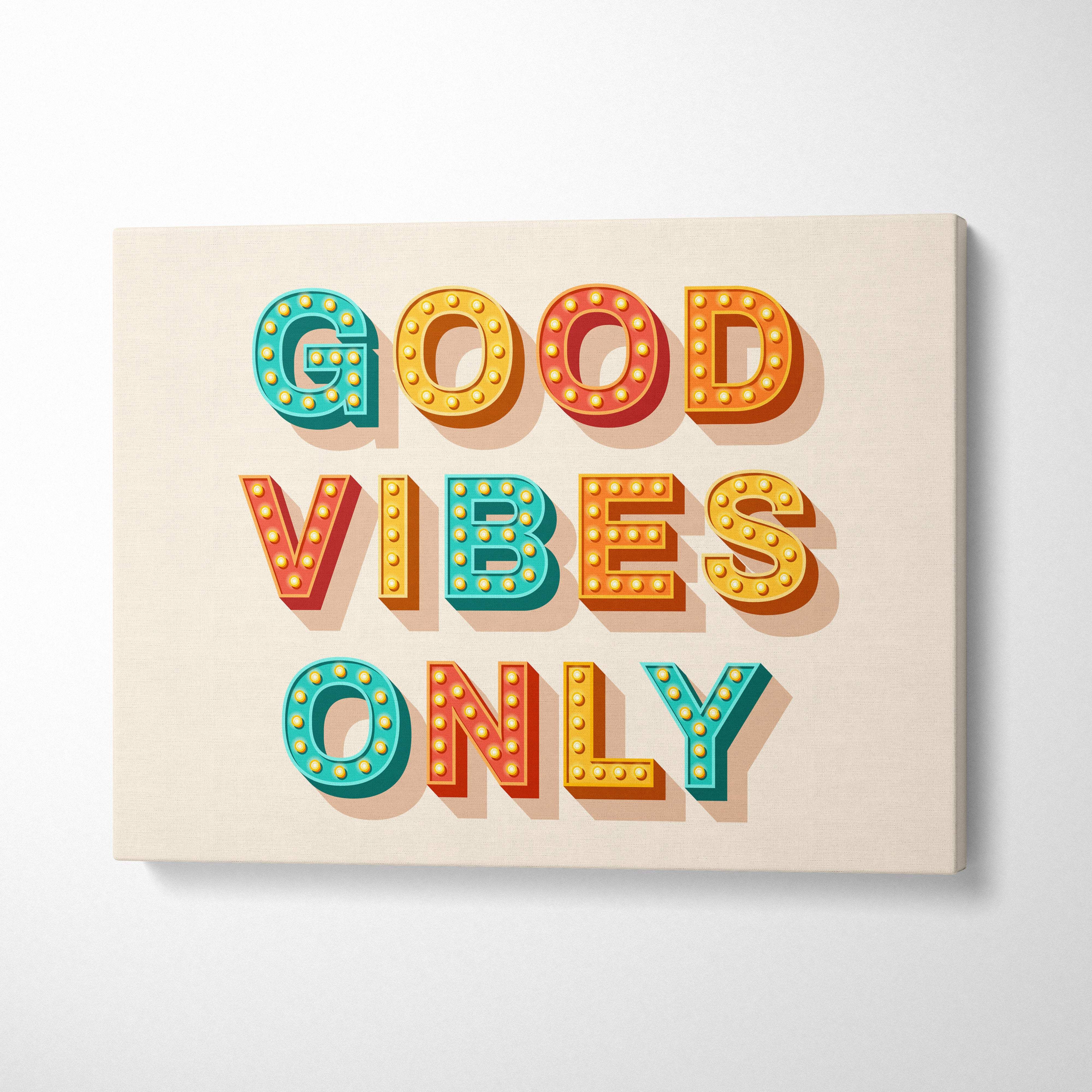 Colorful illuminated good vibes only canvas print with teal and orange letters on cream background for office or bedroom decor