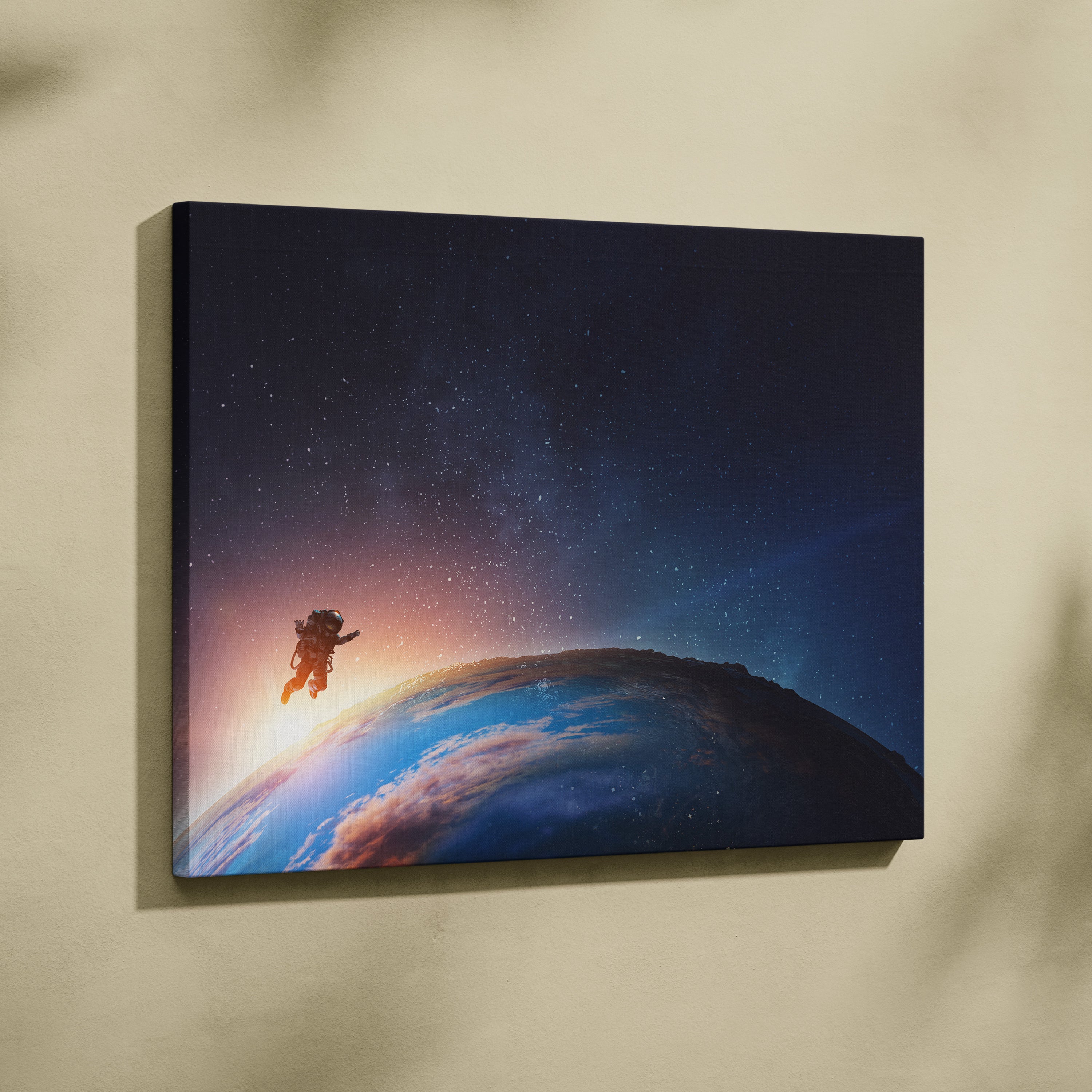 Rectangular canvas print of a lone astronaut floating above earth with blue starry space sunrise decor for bedroom or office