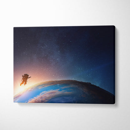 Rectangular canvas print of an astronaut floating above earth with a blue starry space sunrise for modern decor