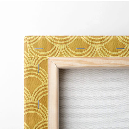 Golden textured canvas with scalloped Art Deco pattern in metallic yellow tones, light wood frame