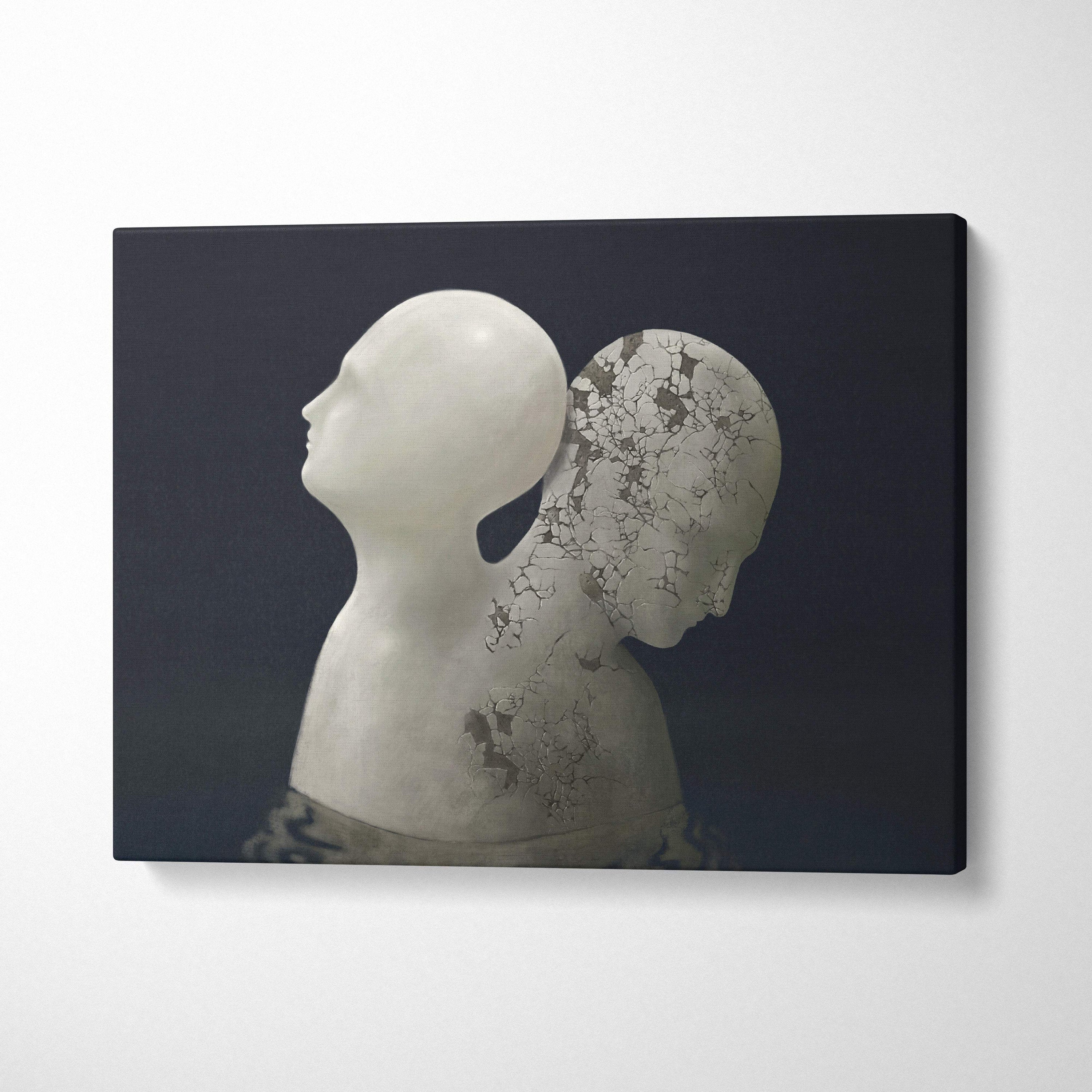 White sculptural canvas print of two stylized human heads one smooth and one cracked revealing dark tones