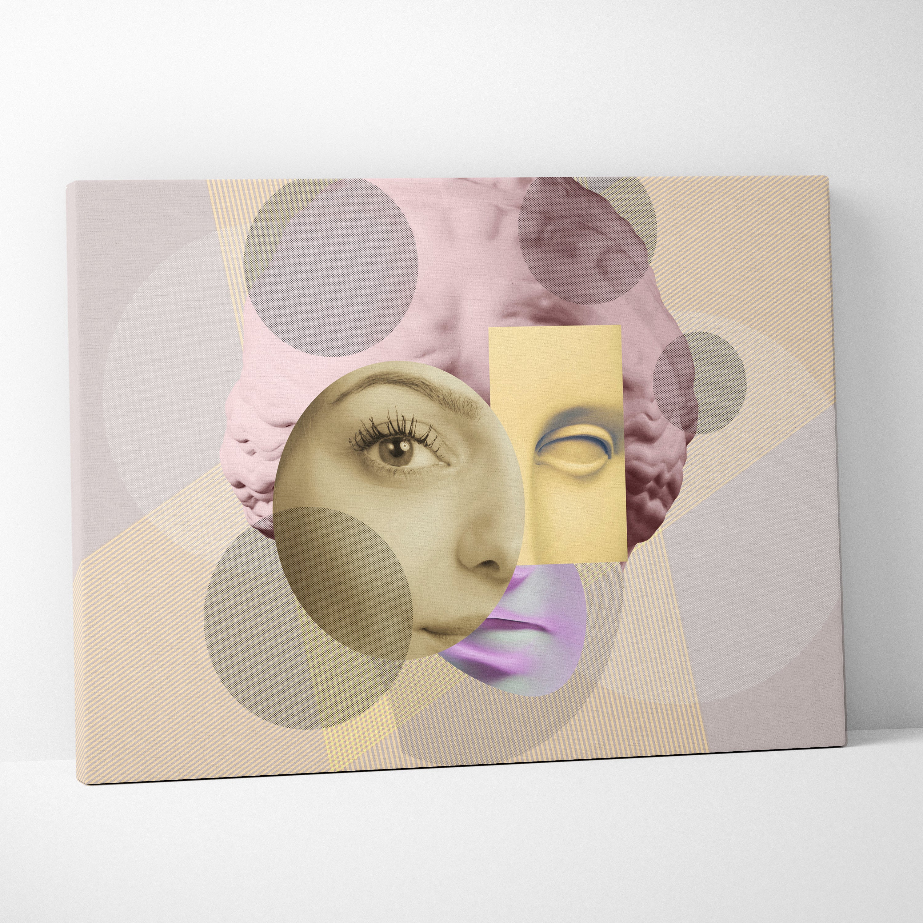 A modern surreal face collage canvas wall art print with pastel pink and yellow abstract portraits on beige textured background