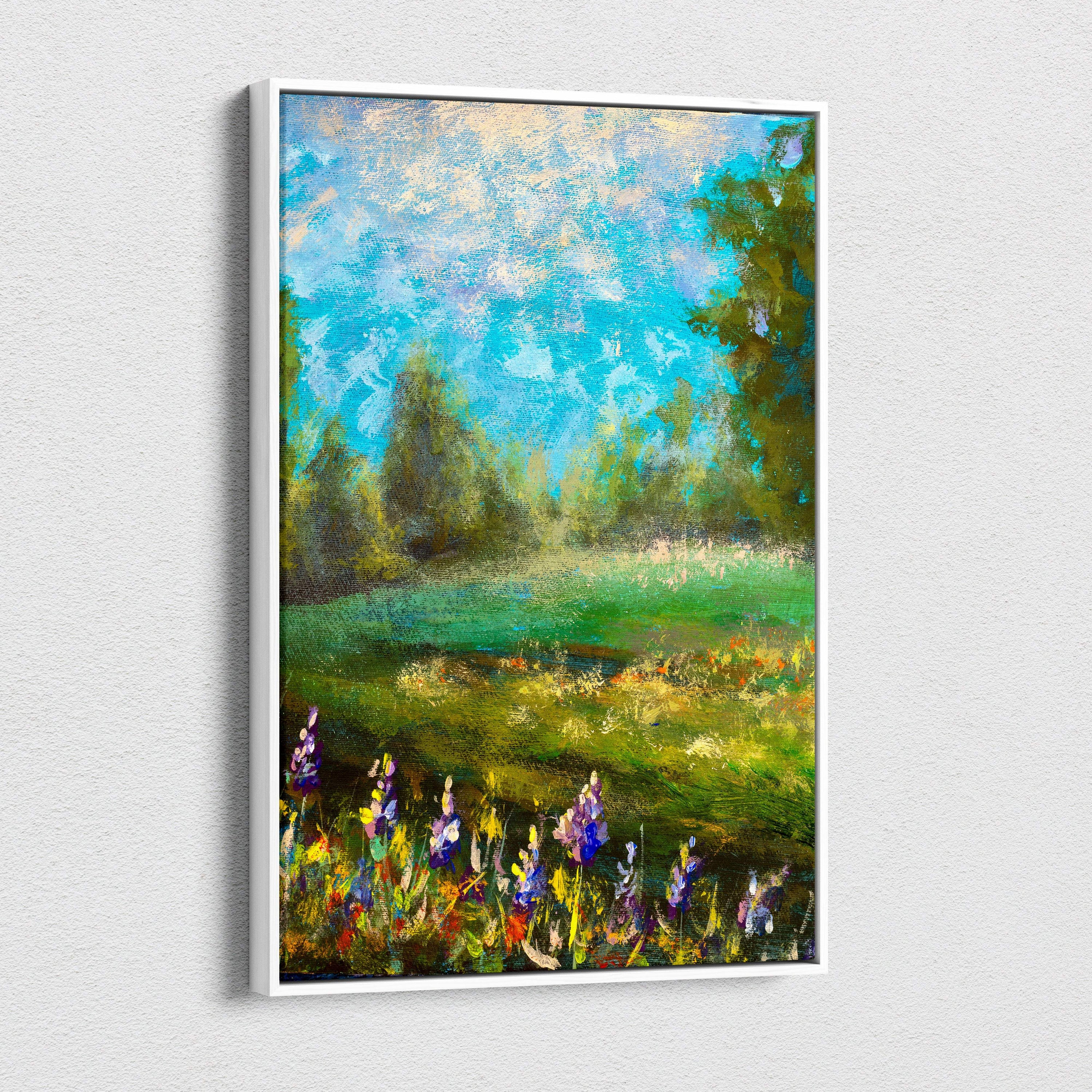 A framed green meadow landscape canvas print featuring purple and yellow wildflowers under a blue sky