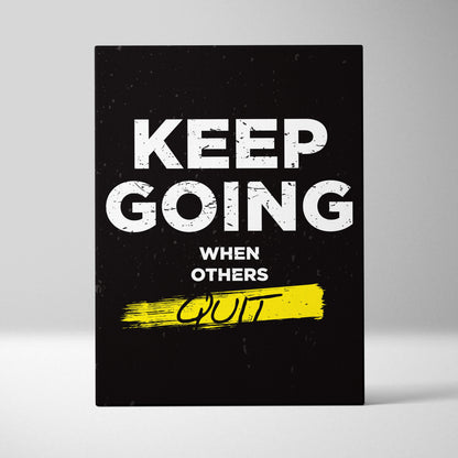 Black canvas print with bold white keep going when others quit phrase and yellow brushstroke for gym office or home decor