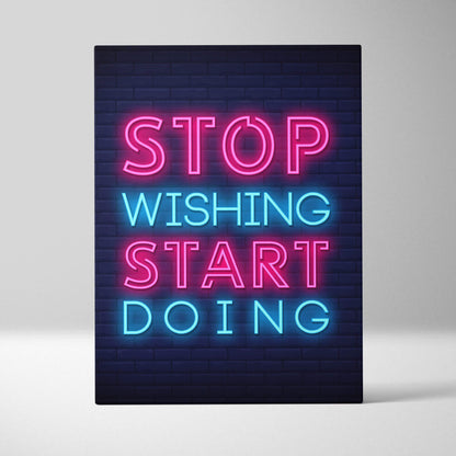 Stop wishing start doing motivational neon wall art canvas with pink and blue glowing letters on dark brick background
