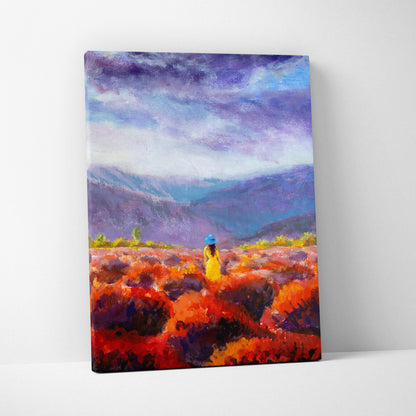 Vibrant meadow landscape canvas print showing a lone woman in yellow and blue in fiery orange fields under dramatic sky