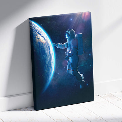 Rectangular canvas print of a floating astronaut near earth with blue cosmic space and starry galaxy background