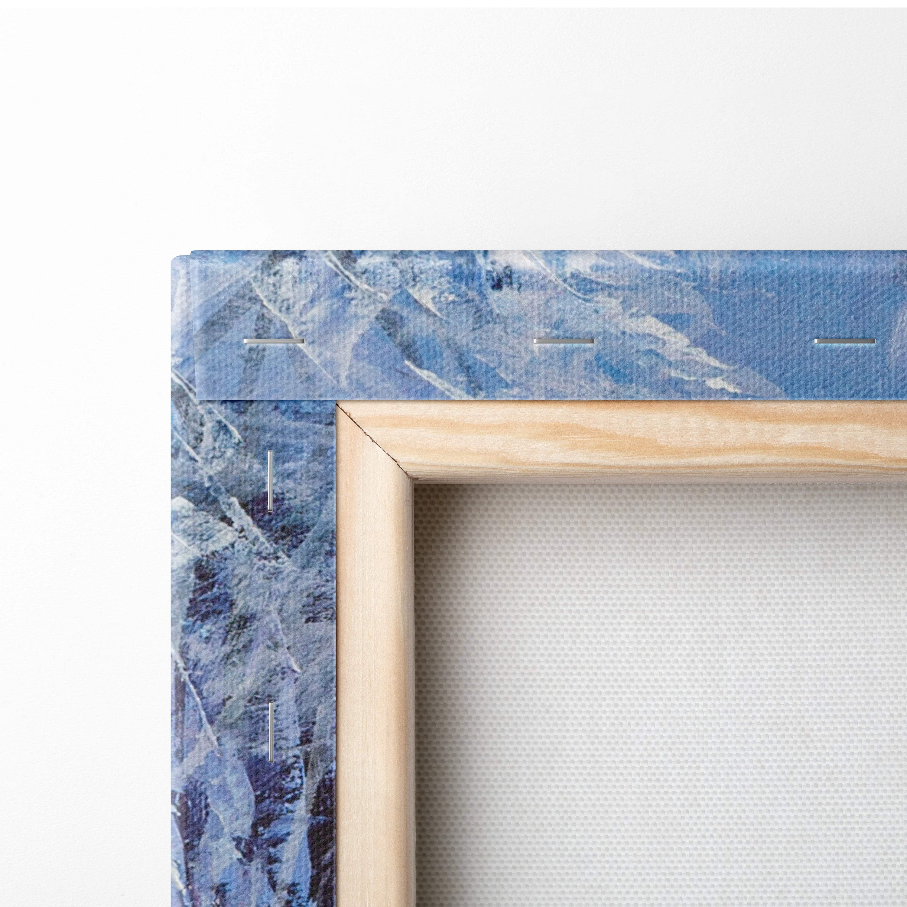 A light wood-framed canvas print featuring a textured blue and white abstract winter river painting style wall art