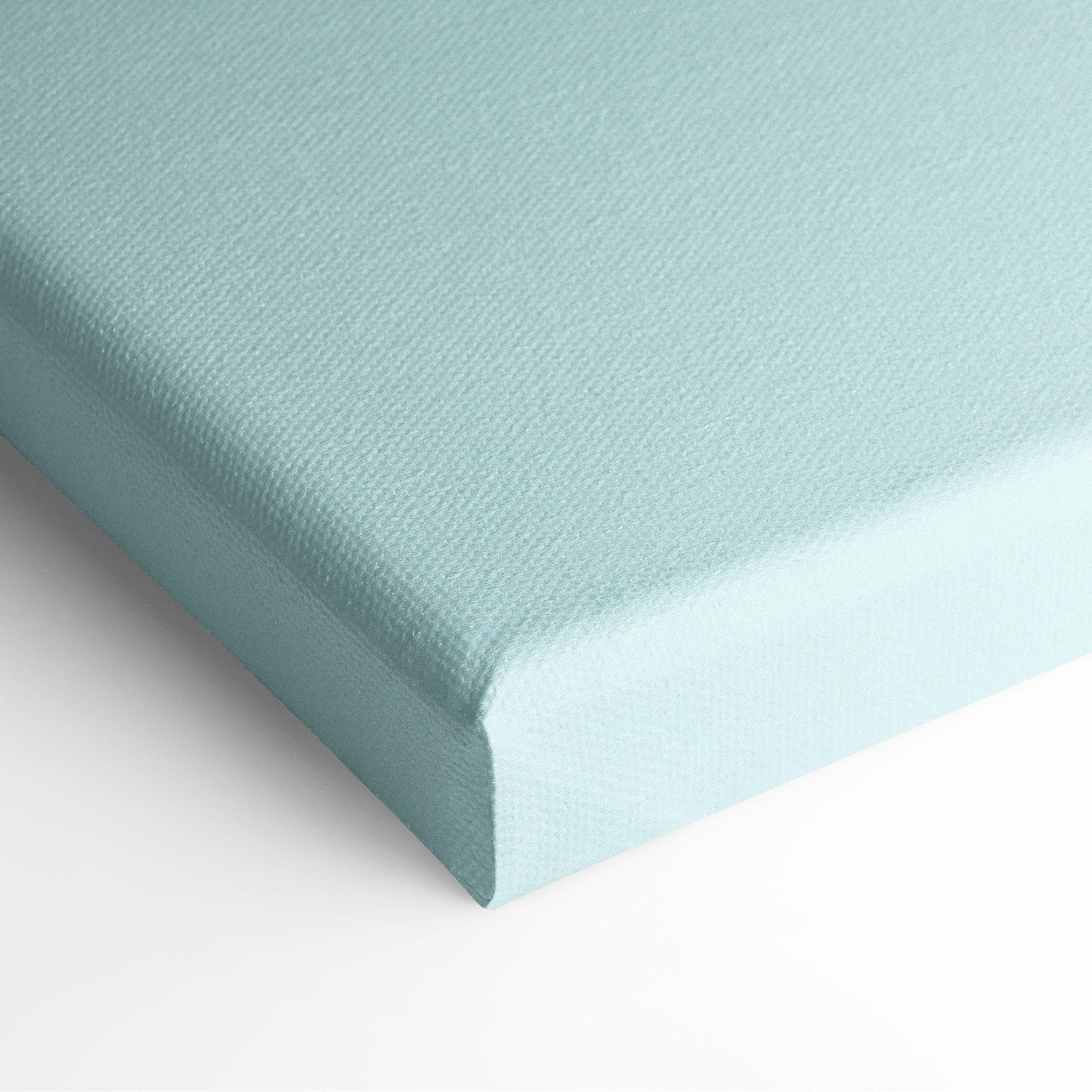 A soft mint green canvas with a textured woven surface and clean rounded edges from contemporary lone figure wall art