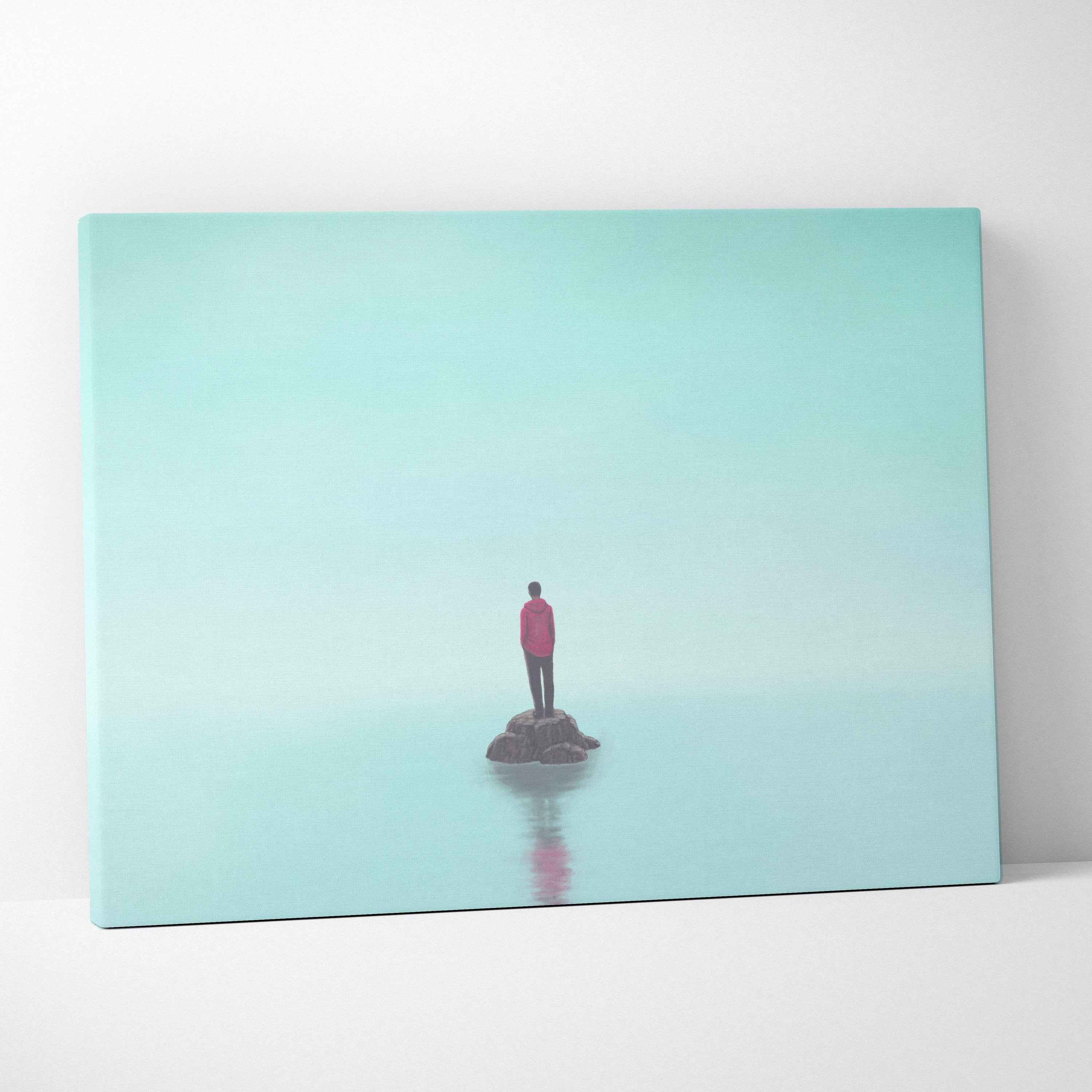 Contemporary lone figure canvas wall art with a solitary red jacket figure on dark rock in minimal aqua landscape print