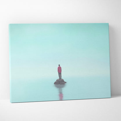 Contemporary lone figure canvas wall art with a solitary red jacket figure on dark rock in minimal aqua landscape print