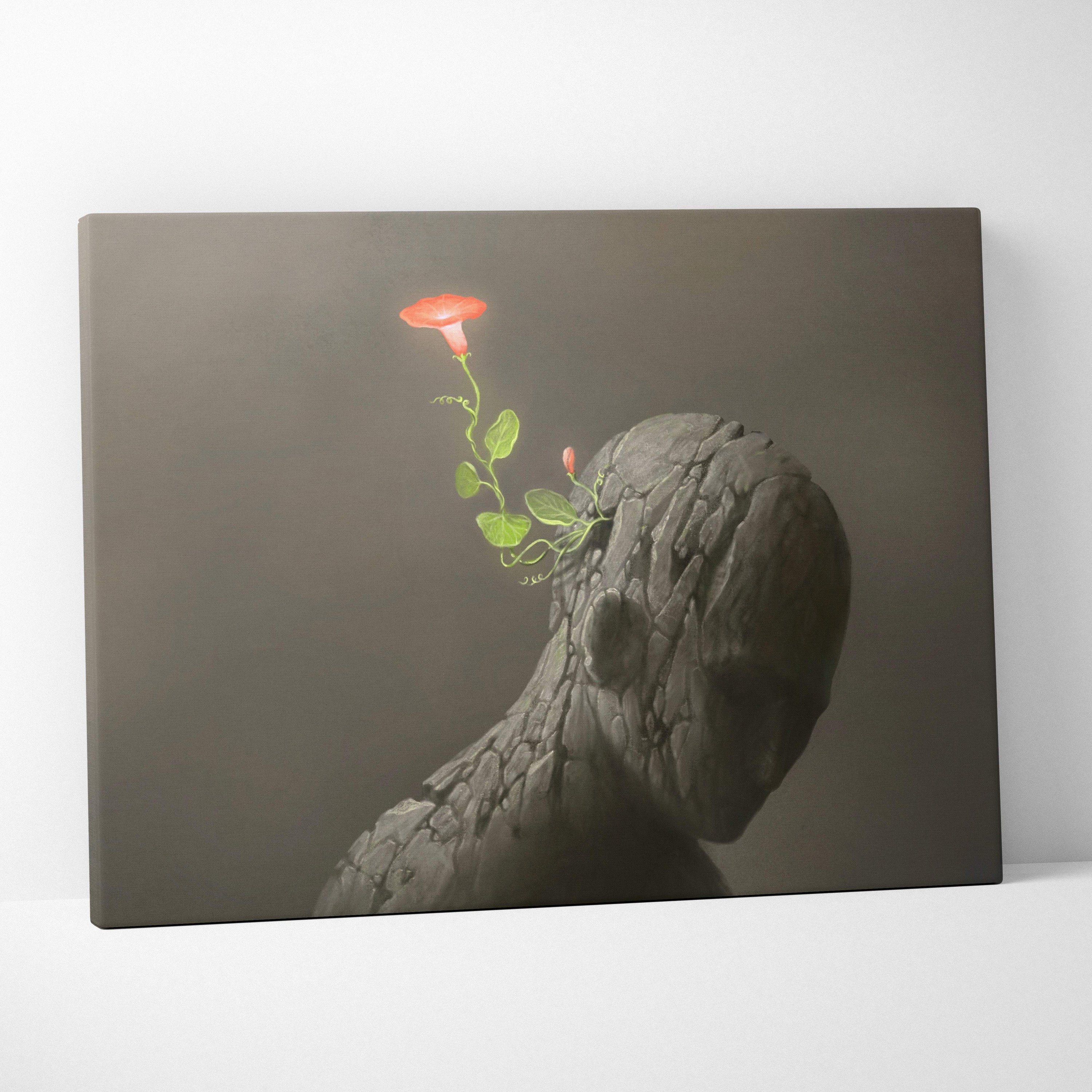 Contemporary flower head canvas wall art with textured stone-like head and vibrant red bloom and green leaves decor