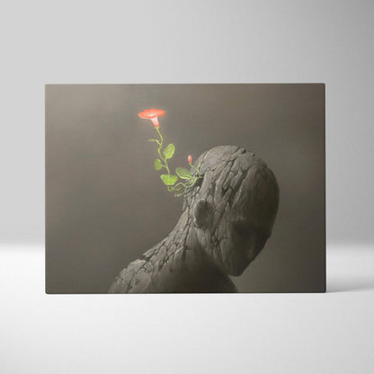 A matte-finish canvas print of a textured stone-like human head with a vibrant red flower and green stem emerging from the temple