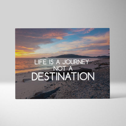 Beige rectangular canvas print featuring a sunset beach scene with life is a journey not a destination quote in white text