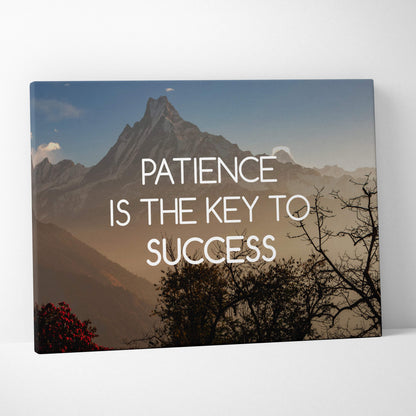 Rectangular canvas wall art featuring a mountain landscape with the phrase patience is the key to success in white text