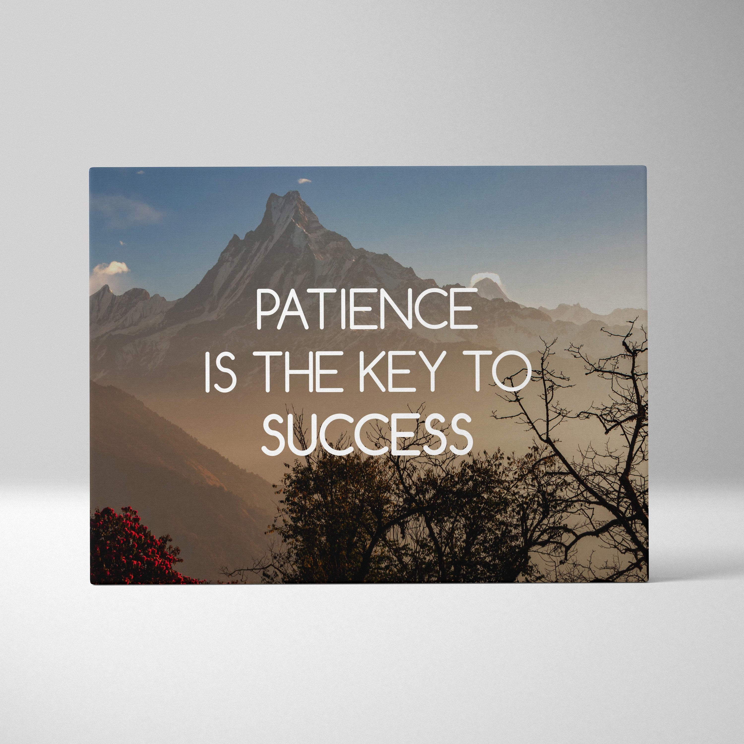 Rectangular canvas print featuring a mountain landscape with white text patience is the key to success inspirational decor