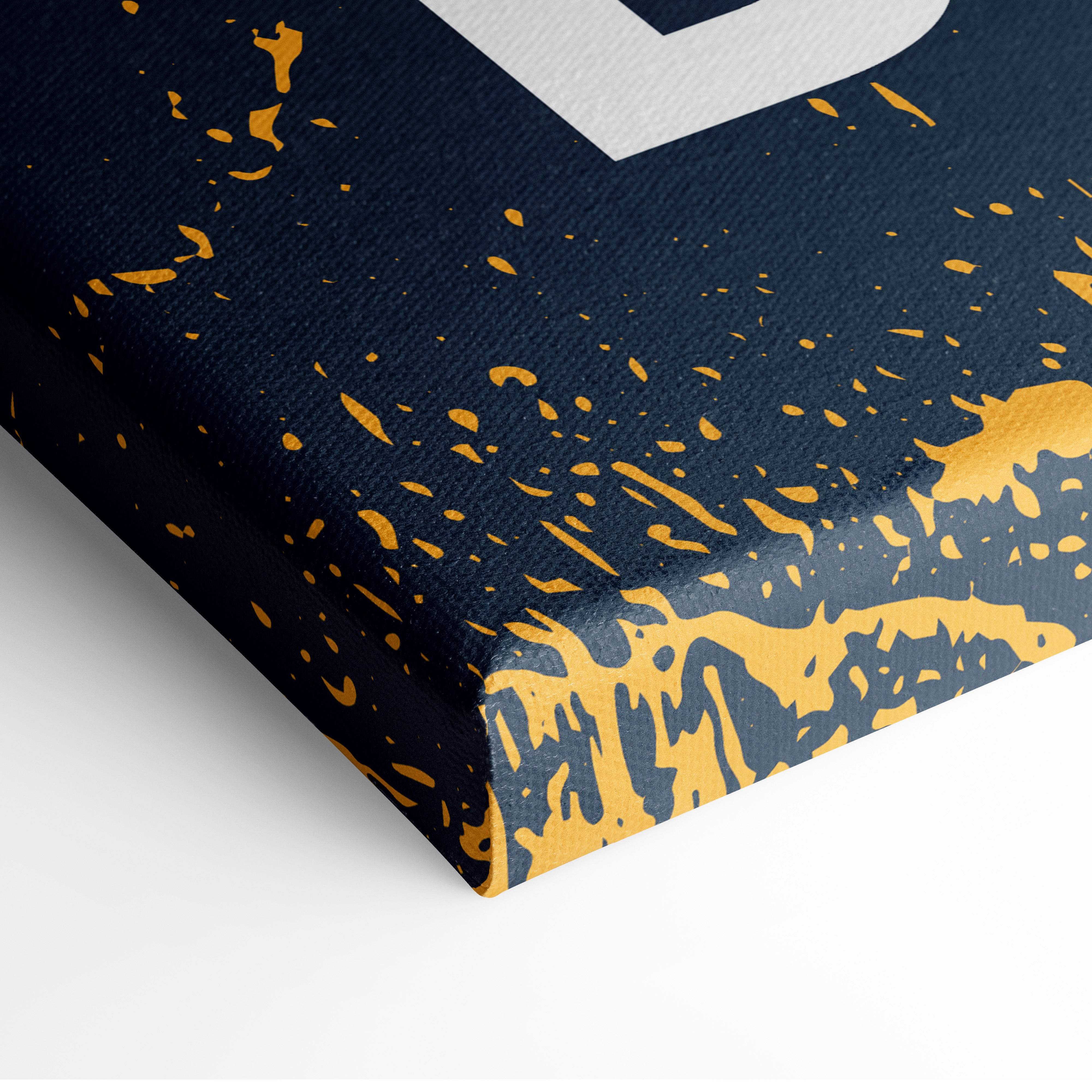 Navy blue canvas wall art with gold splatter and white b letter featuring motivational productivity quote decor