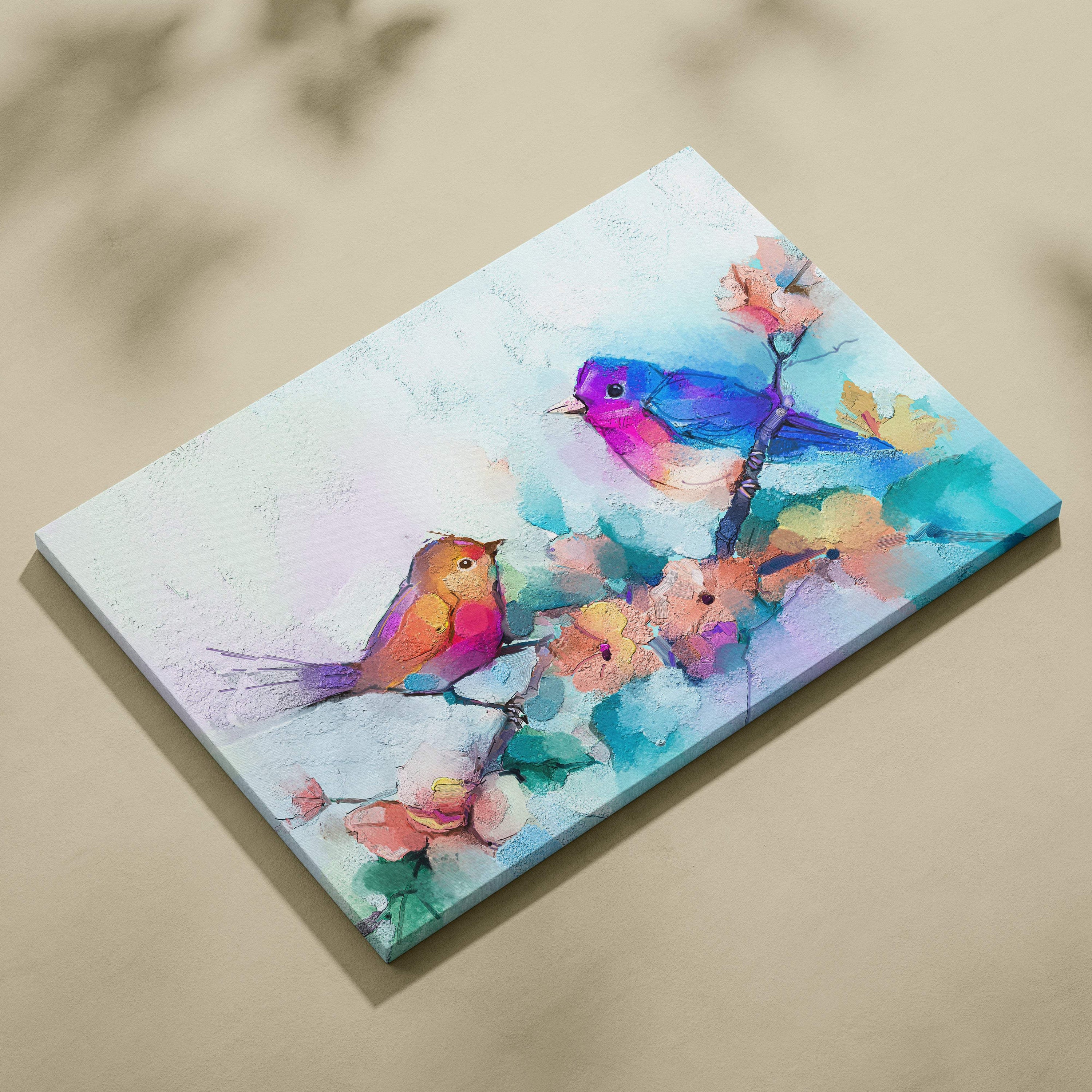 Vibrant pastel nature canvas print featuring colorful birds perched on blossoming branches in watercolor style
