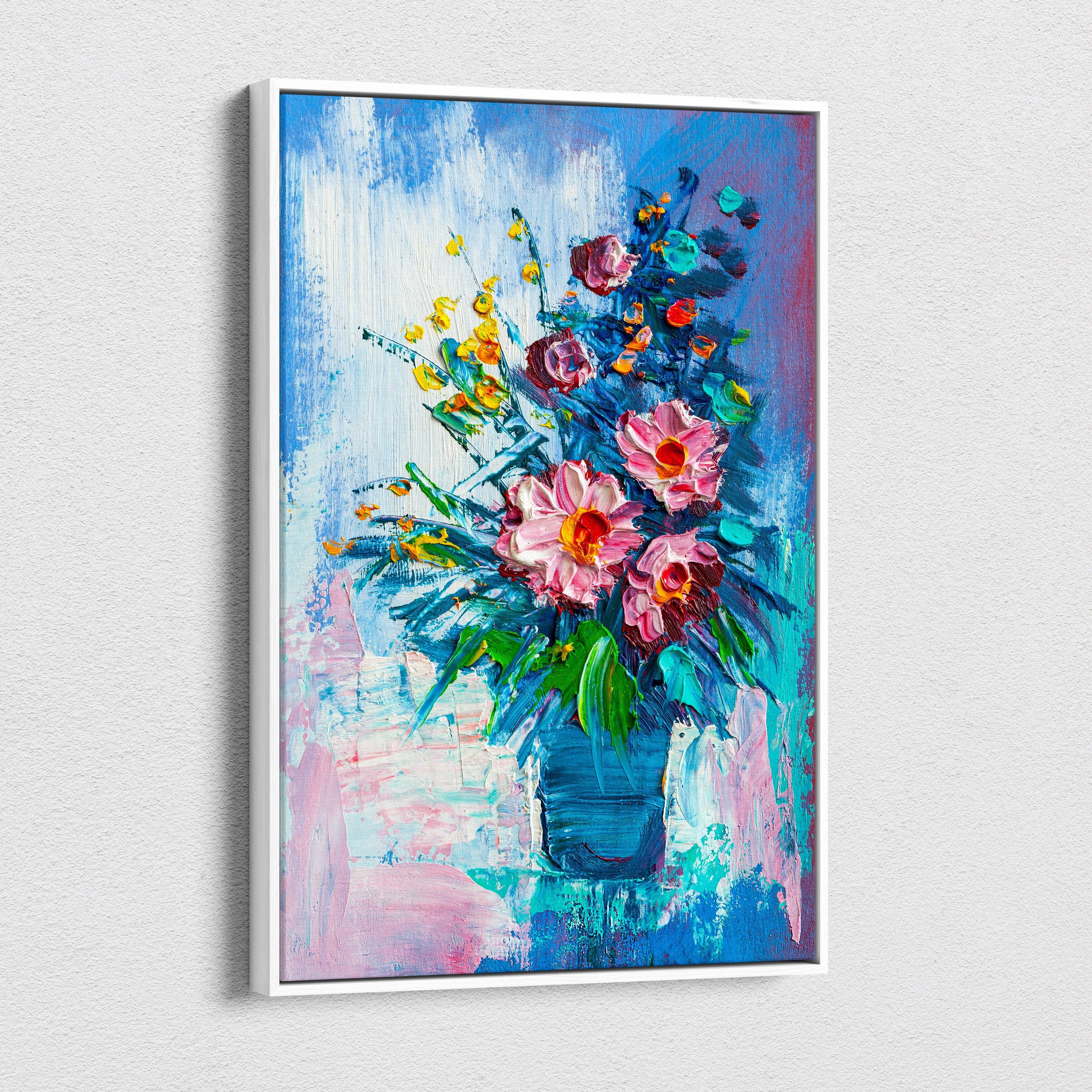A vibrant floral still life canvas print of pink and yellow flowers in a blue vase with thick textured brushstrokes