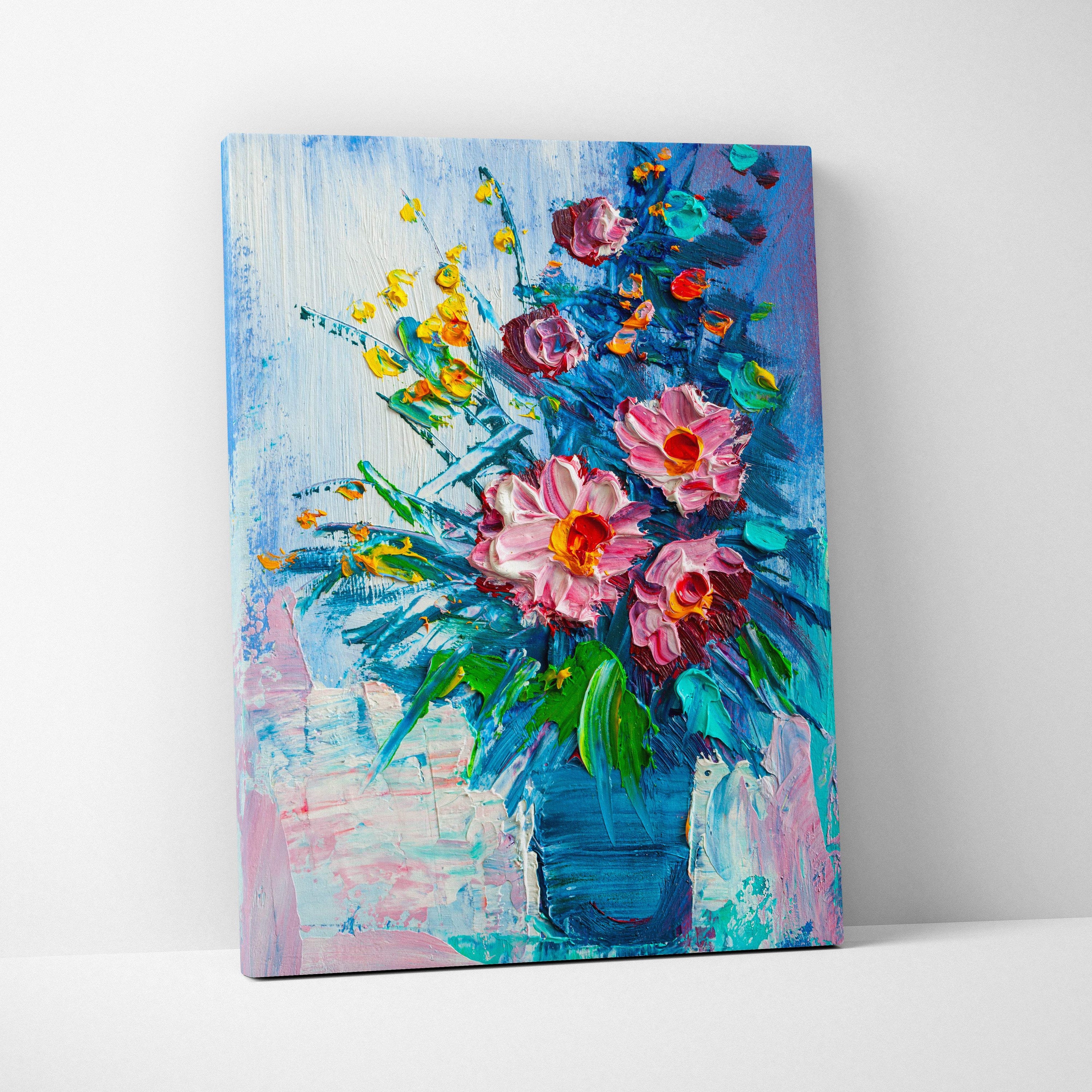Vibrant floral still life canvas print featuring bold pink and yellow flowers in a deep blue vase with textured brushstrokes
