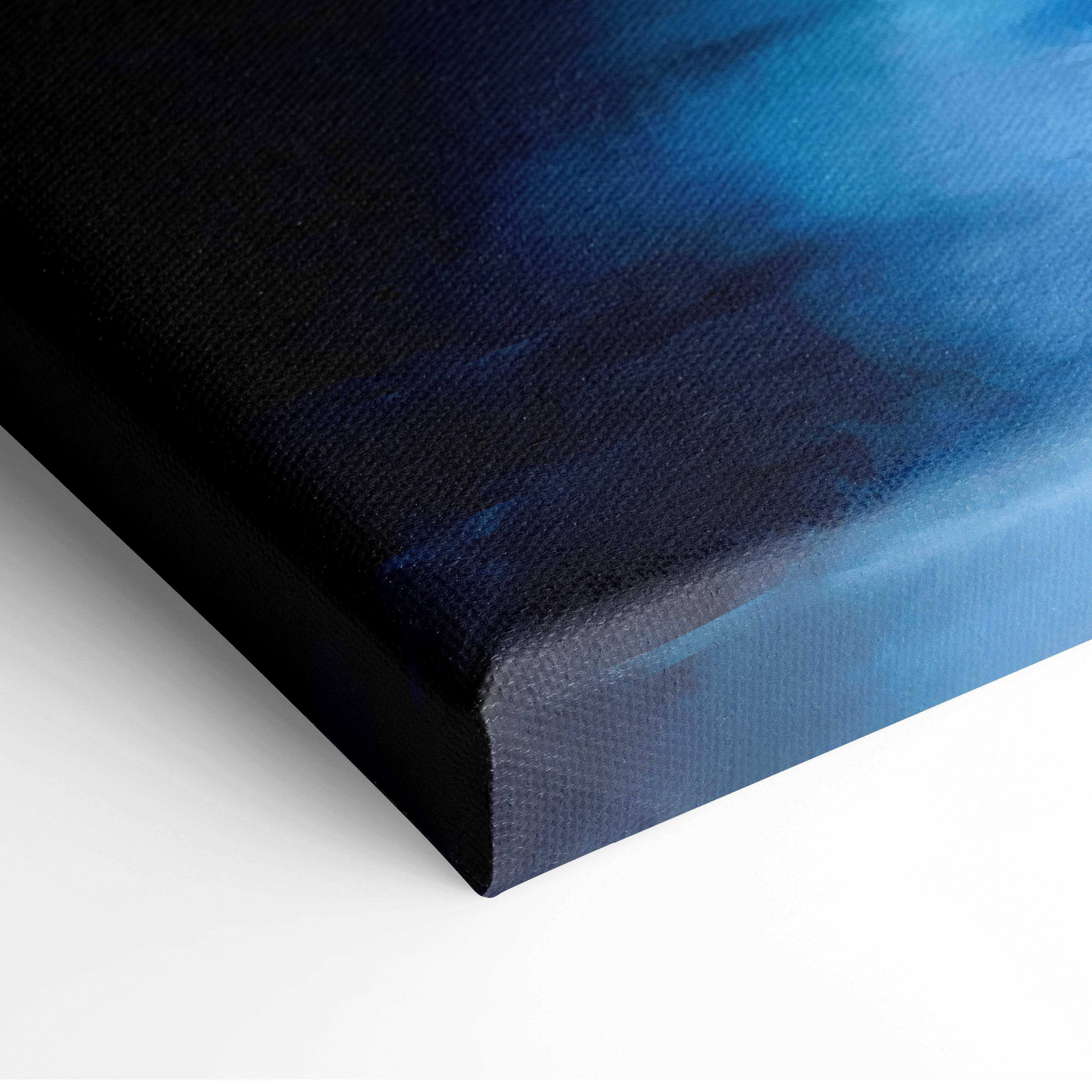 A canvas print titled mystical blue castle in fog featuring a deep navy to vibrant blue gradient with textured surface and black frame
