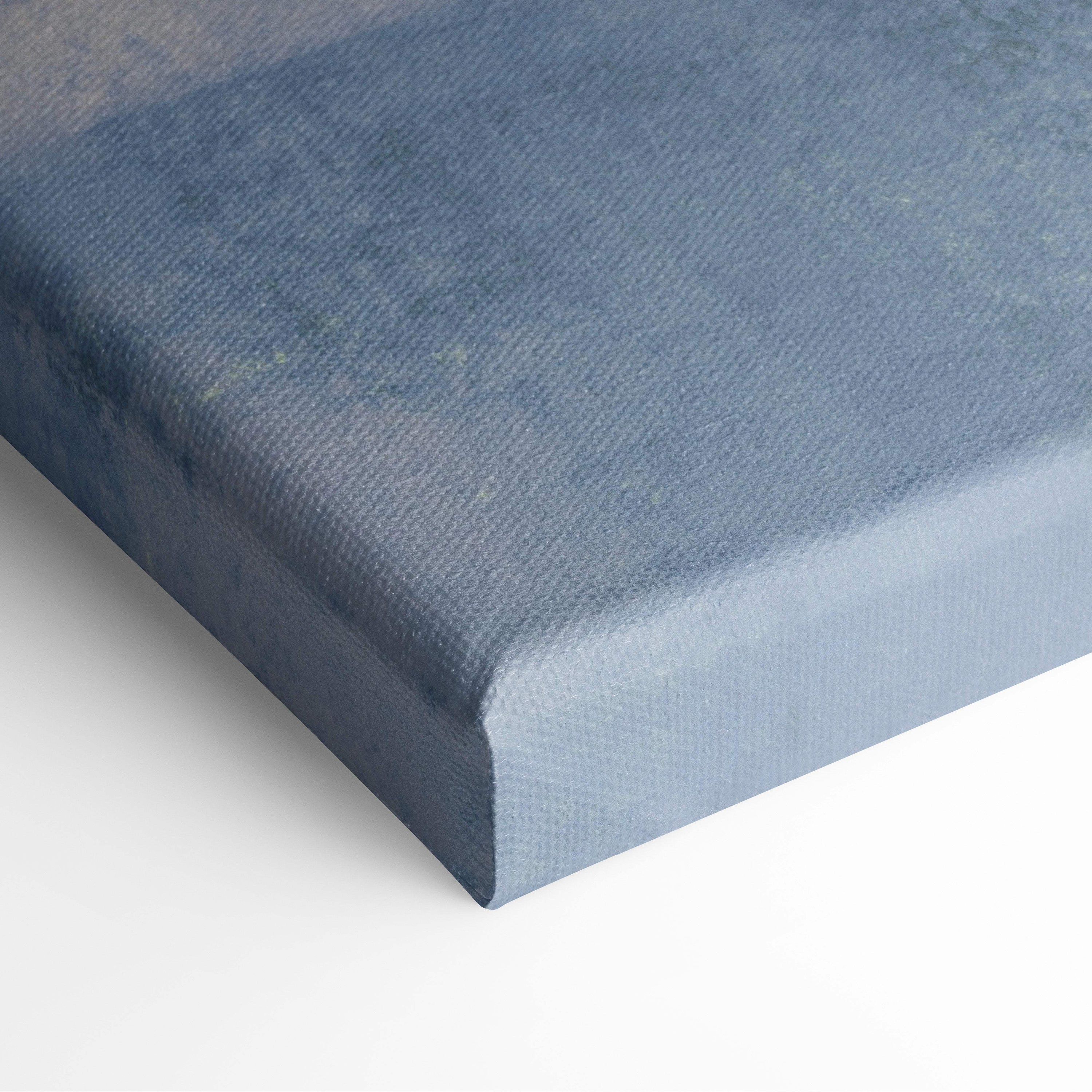 Contemporary ocean window canvas wall art in textured blue with subtle gradient and visible weave for coastal decor