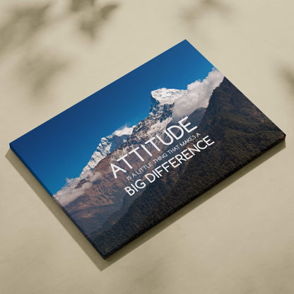 Motivational mountain canvas wall art featuring a snow-capped peak and the quote attitude is a little thing that makes a big difference